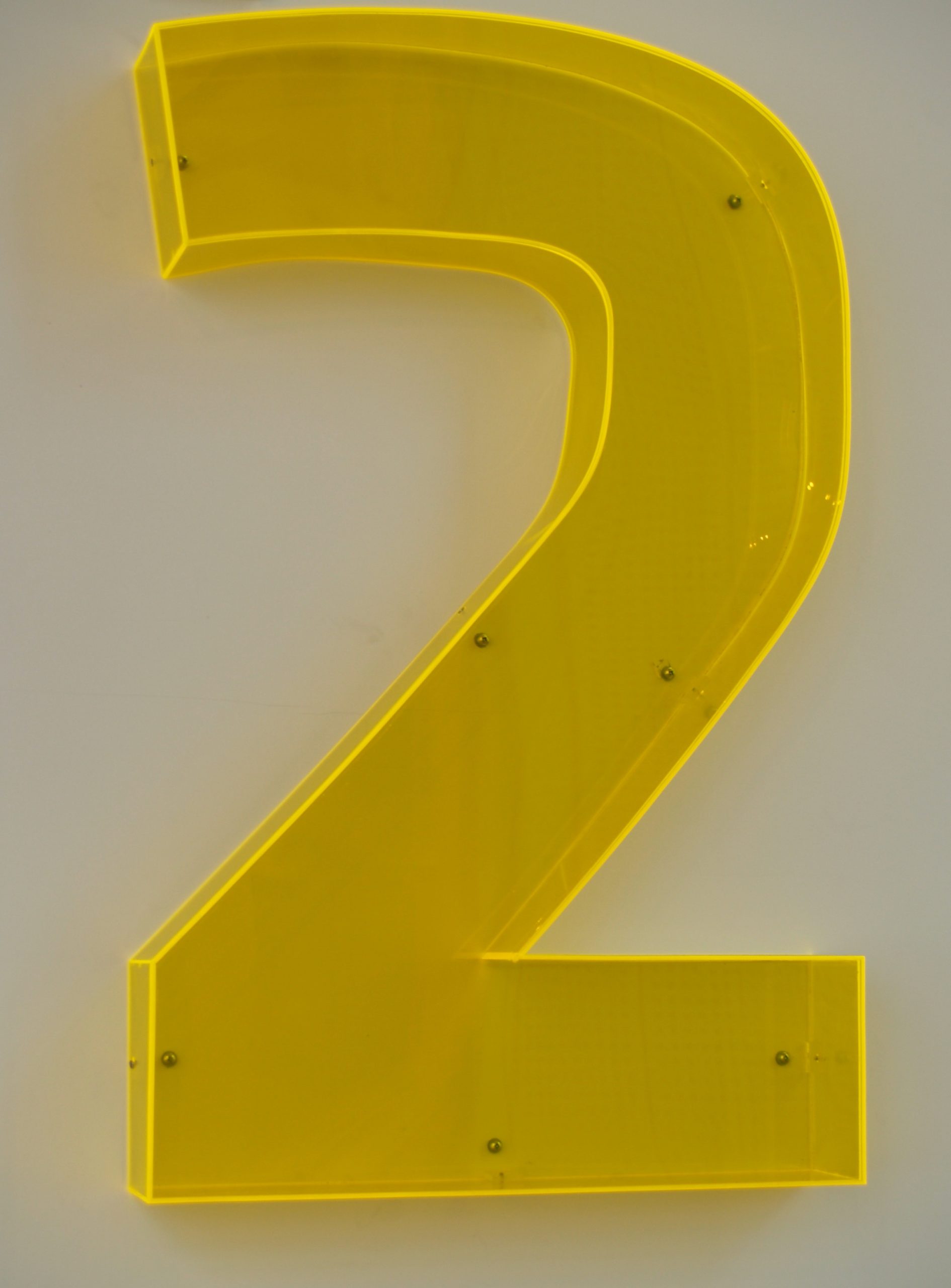 Large fluorescent perspex number 2 sign for floor two
