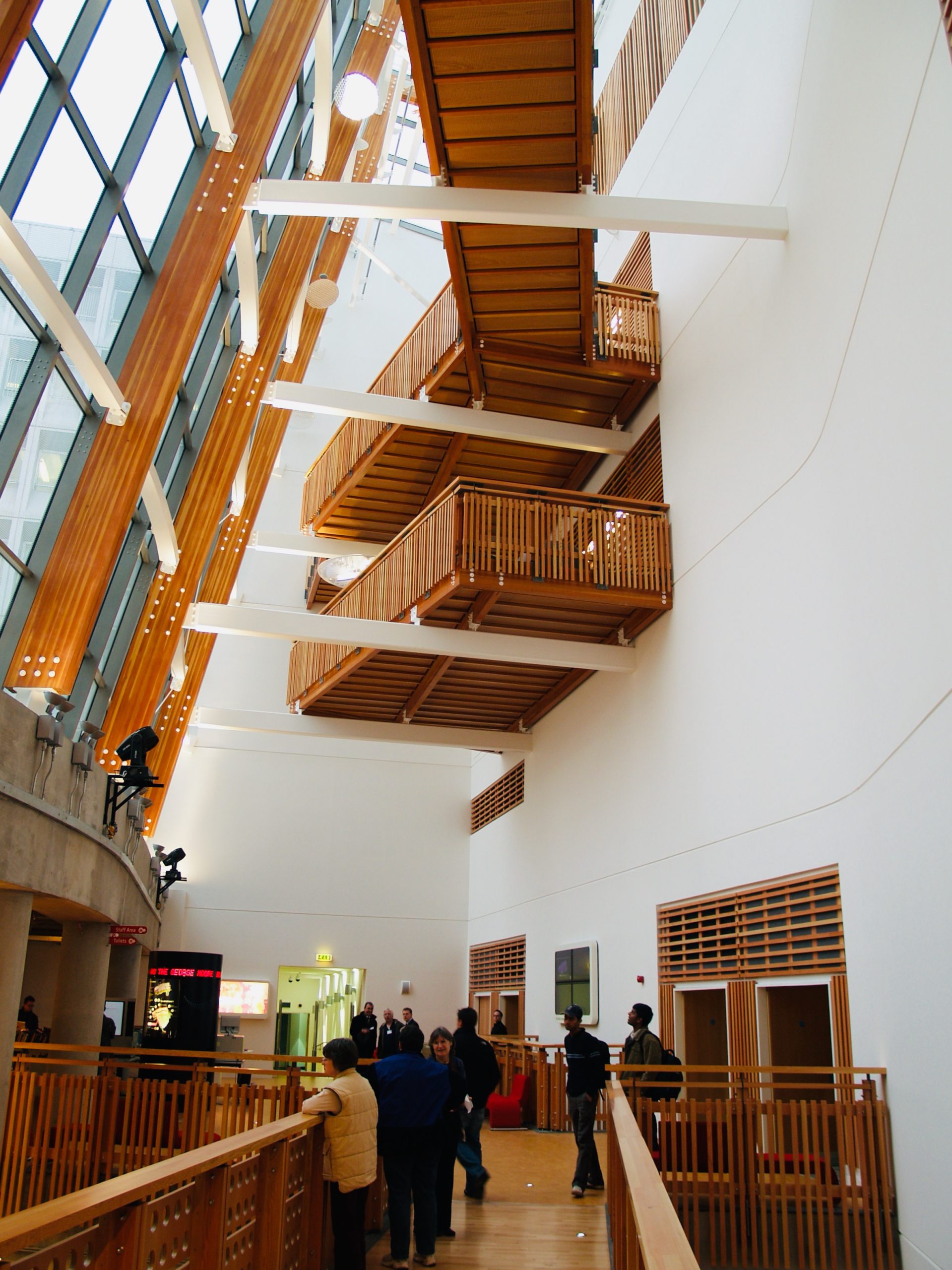 View through the atrium of the Saltire Centre from the first floor showing balcony and upper level walkway